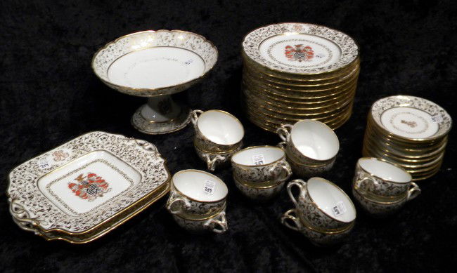 37 Pc Ornate Dinnerware, Made in City of Sevres : 37 Piece Ornate Porcelain Dinnerware - Decorated with Coat of Arms Made in City of Sevres - 12 Luncheon Plates, 12 Cups, 10 Saucers, Pedestal Bowl and 2 square plates - (2 Cups Chipped) - Vintage