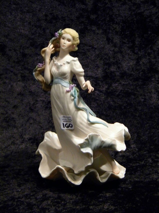 Cybis Figurine of Young Girl on Sea Shell: Cybis Figurine of Young Girl on Sea Shell, 9" high