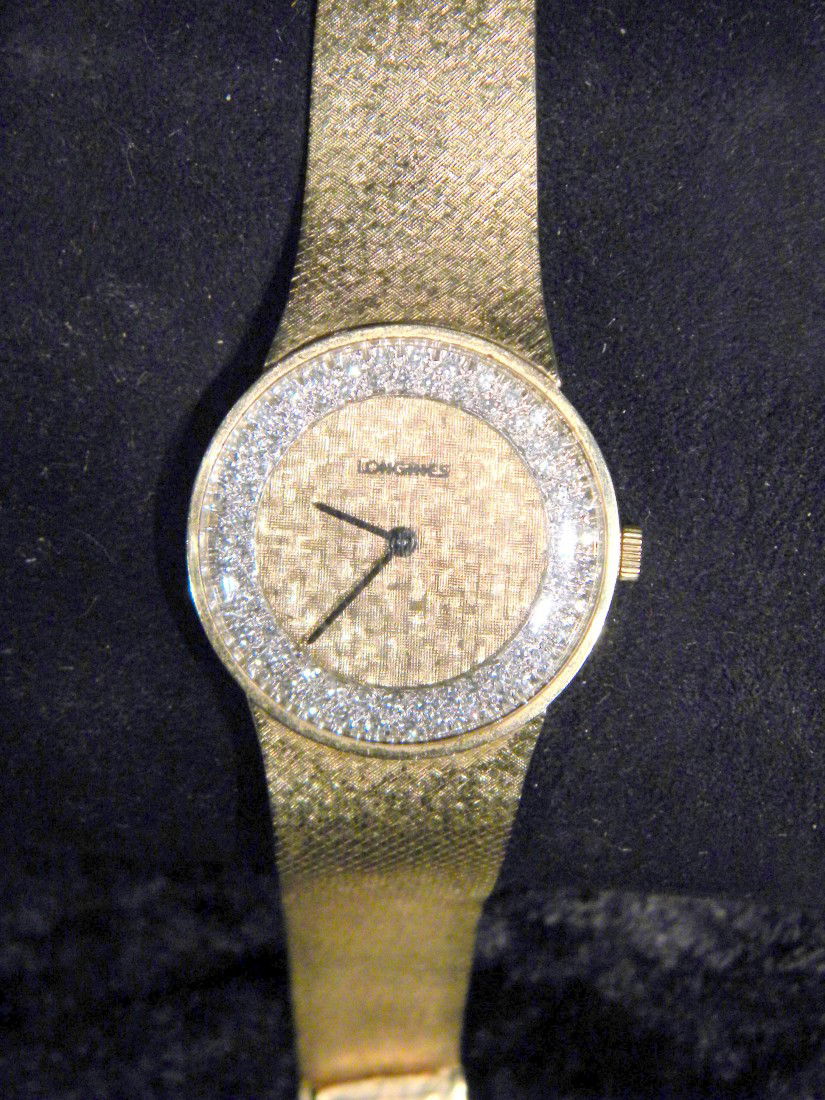 14Kt Yellow Gold Longines Wrist Watch w/ Diamond Bezel: Vintage 14 Kt yellow gold 17 jewel Longines men's wrist watch with diamond enhanced bezel and 14Kt integral gold band. Manual wind. Approx 2-2.5 ctw diamonds. Longines logo on clasp. 50 total grams fo