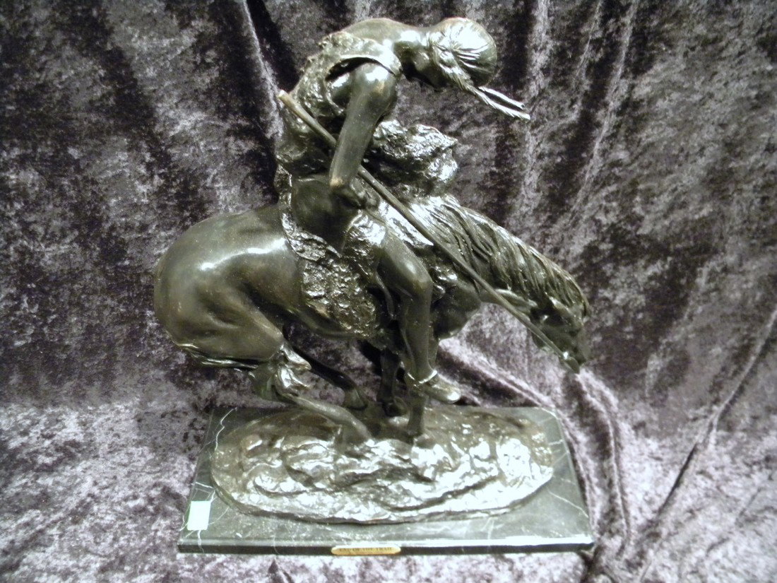 Reproduction Frederic Remington Bronze, "End of the Tra: Reproduction Frederic Remington Bronze, "End of the Trail", signed Remington, on black marble base, 20" high, 17" wide. Plaque reads "End of the Trail" by James Fraser". Modern