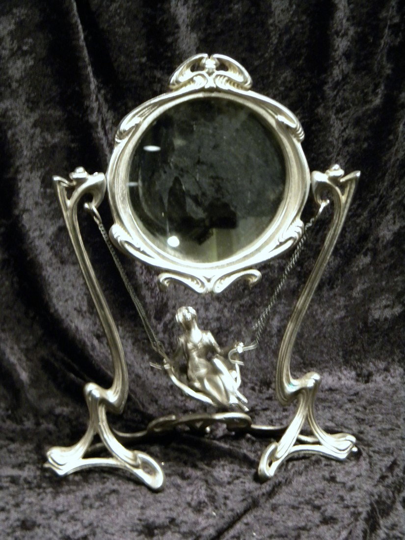 Art Nouveau Style Cast Metal Table Mirror w/Woman on Sw: Art Nouveau style table mirror decorated with woman on swing, 17.25" high. Modern