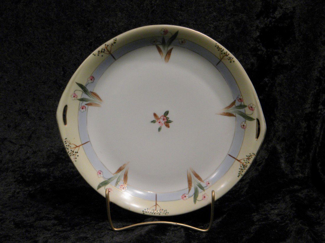 2-Handled Porcelain Platter dec w/Hand Painted Flowers: Two-handled porcelain platter decorated with hand painted white and pink flowers, marked Nippon, 10.25" diameter.