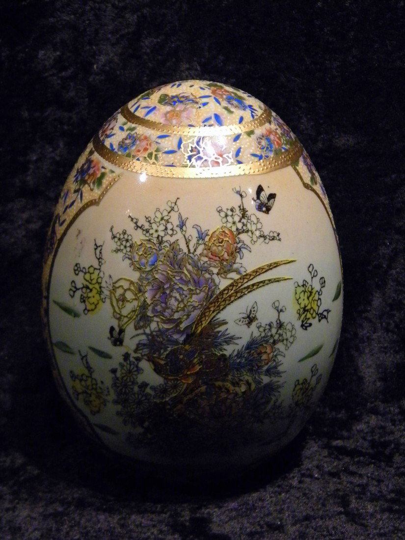 Hand Painted Porcelain Figural Egg Sculpture dec/w Flow: Porcelain figural egg decorated with painted flowers, leaves and gold accents, 6.5" high