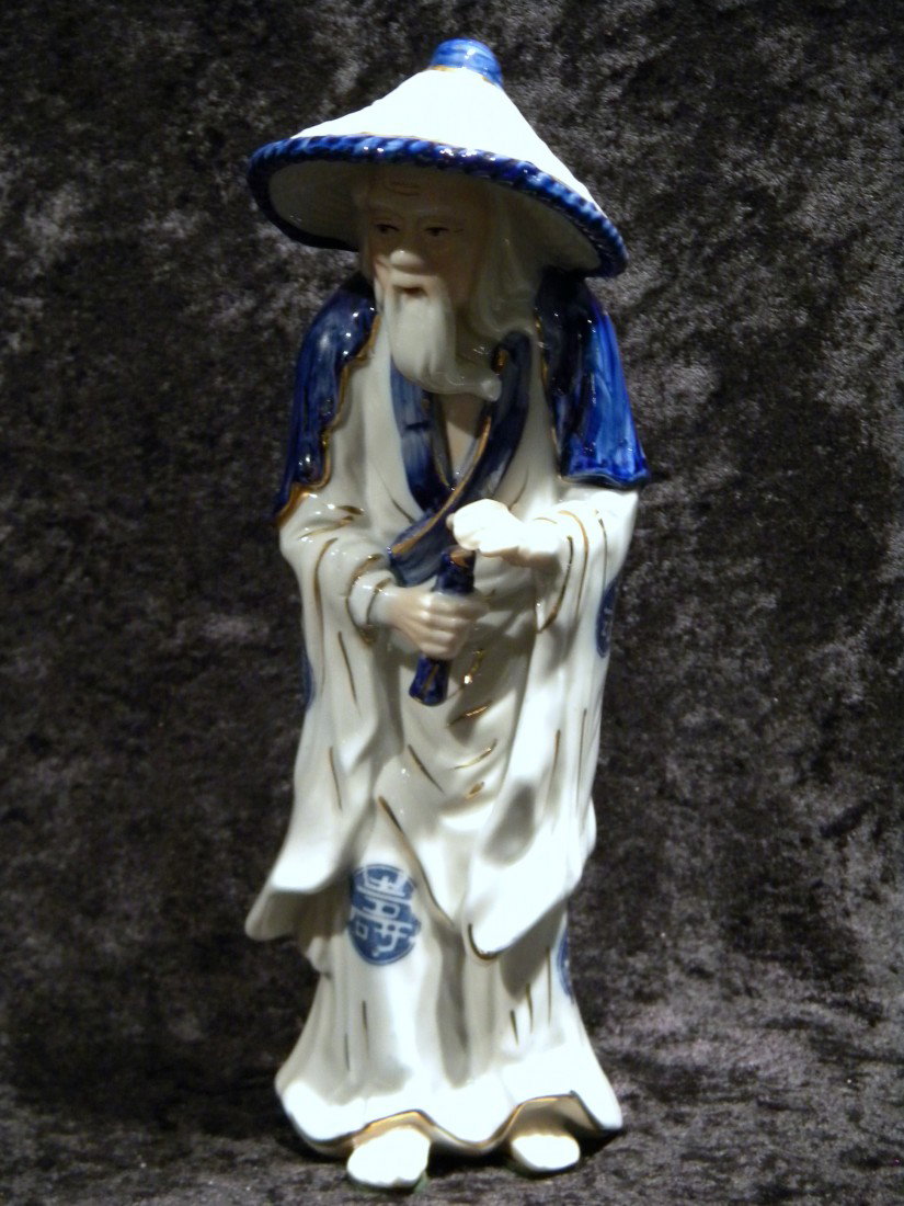 Japanese Blue & White Porcelain Figurine: Japanese blue and white porcelain figurine, old bearded man wearing hat, marked Japan on base, 10" high
