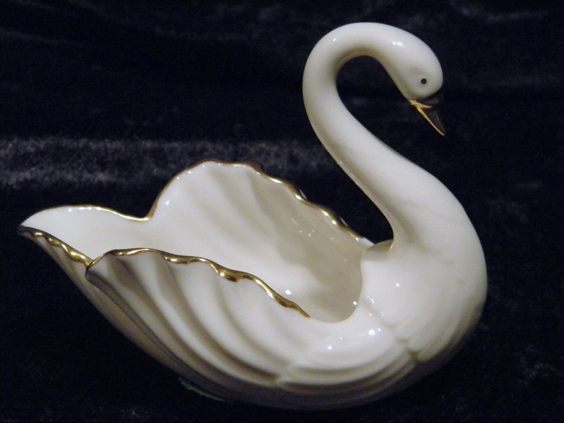 Lenox Porcelain Figural Swan Dish: Lenox porcelain figural swan dish with gold beak and gold trim around back feathers, 3.75" high, 5" wide