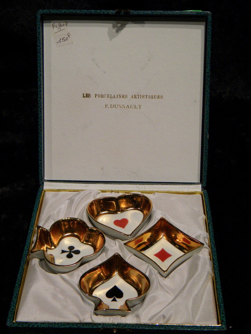 4 Limoges Porcelain Nut Cups in Original Box: Four Limoges porcelain nut cups in original box depicting the card game of bridge suits of spades, diamonds, clubs, and hearts. Inner lid of box marked "Les Porcelaines Artistiques" - P. Dussault