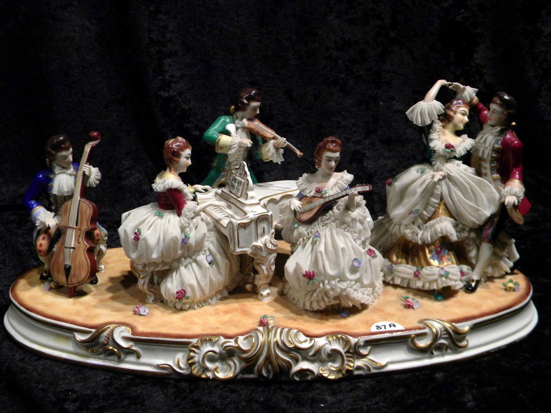 (Crown) MZ Dresden Style Porcelain Figural Group w/6 F: (Crown) MZ Dresden style porcelain figural group with 6 figures: dancing couple, lady at piano, standing gentleman with violin, seated gentleman with cello and seated lady with lute (foot missing), 8"