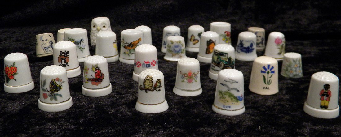 27 Porcelain Thimbles - Many dec/w Animals: Lot of 27 porcelain thimbles - many decorated with animals, all approximately 1" high.
