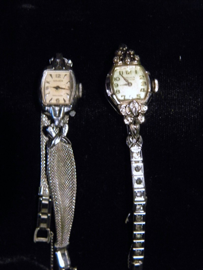 2 Gruen Ladies Watches; 14Kt White Gold & White Gold Fi: Two Ladies Watches: Gruen 14Kt white gold set with small diamonds and Gruen 10Kt white gold filled watch. Vintage