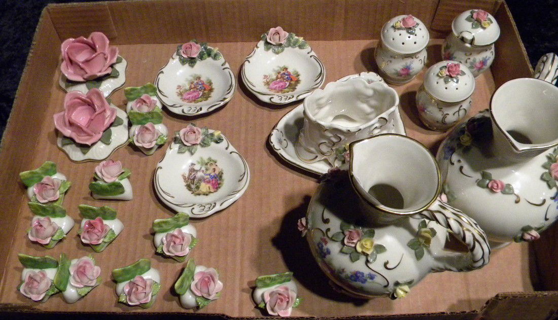 Dresden Germany (Crown) N mark porcelain table accessor: Dresden Germany (Crown) N mark porcelain table accessories decorated with painted and applied flowers and gilded accents: two small pitchers, pair candlesticks, twelve place card holders, mustard pot