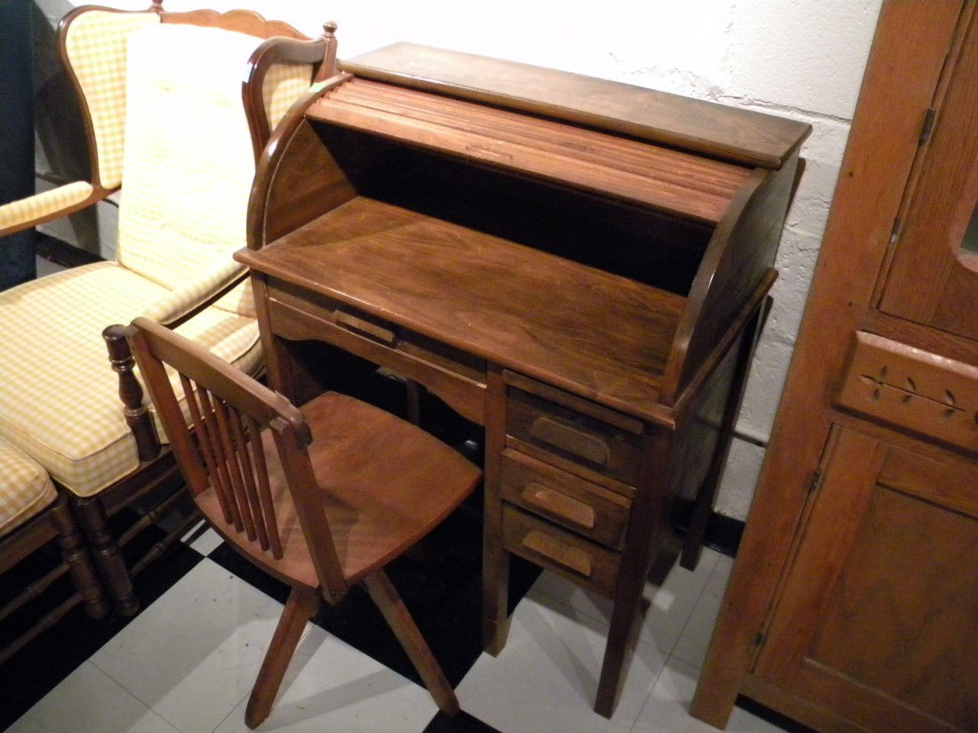 Modern child's roll top desk with 4 drawers and pull ou: Modern child's roll top desk with 4 drawers and pull out writing surface, upper interior pigeon holes and matching adjustable child's desk chair, 37.5" high, 30" wide