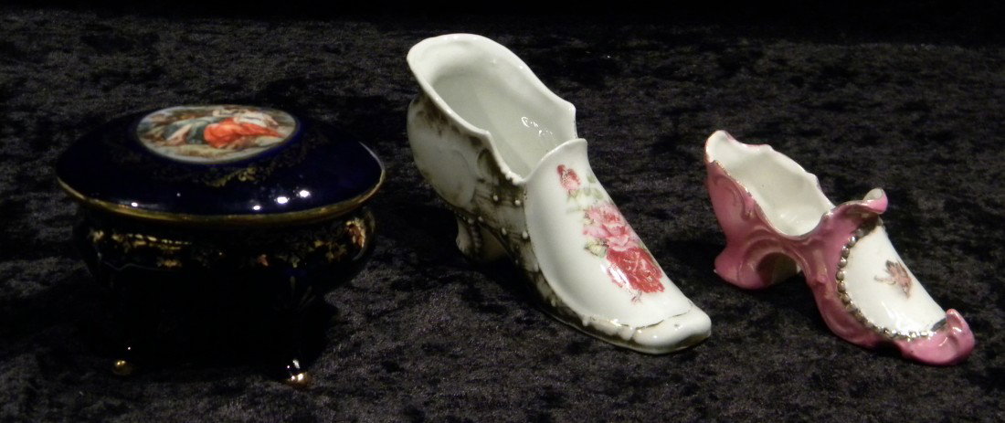 3 Porcelain Items: Trinket Box and 2 Shoes: 3 Porcelain items: cobalt blue lidded trinket box decorated with portrait panel on lid and gilded accents, marked (Crown) M Germany and 2 hand painted porcelain shoes - some wear to gilded accents.