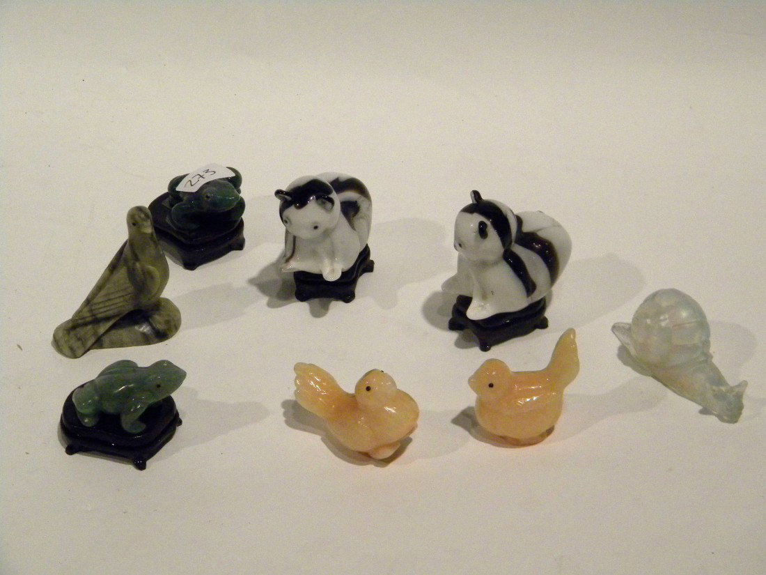 8 Small Animal Figures: 8 Small animal figures: pair stone frogs on wooden bases, pair yellow stone birds on wooden bases, grey soapstone bird, white iridescent glass snail and pair black and white glass cats., 1"-2" high