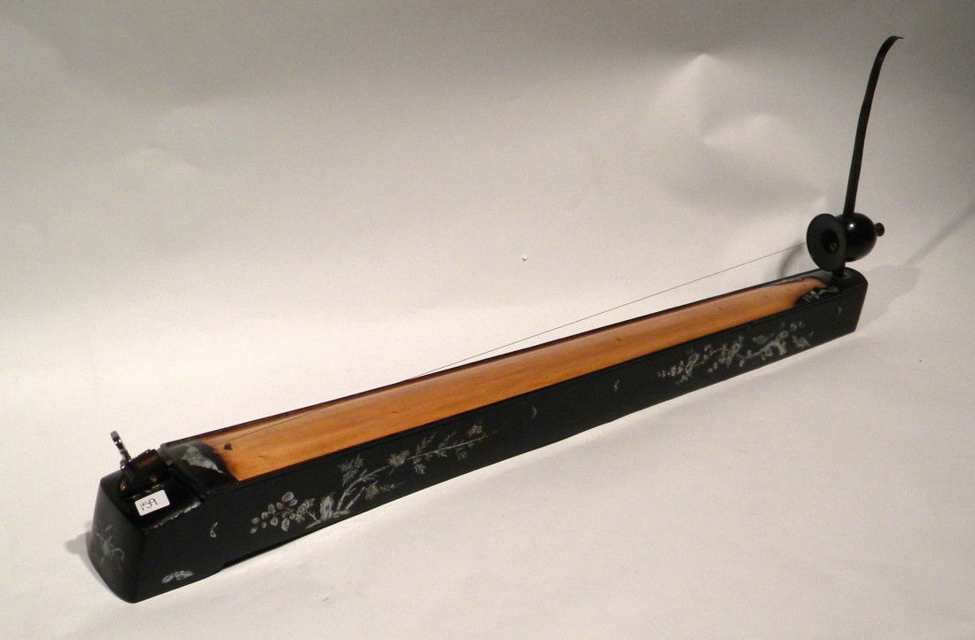 Dan Bau, Vietnamese Single Stringed Instrument: Dan Bau, Vietnamese single stringed instrument with pitch bending bar, black painted with mother of pearl inlay, modified for electric amplification with soft carrying case, 12" high, 30.5" long