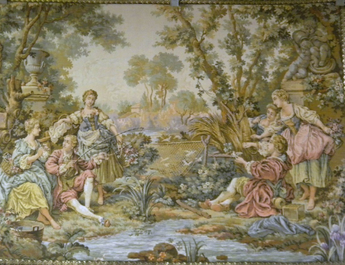 Handwoven Tapestry dec/w Woman & Man Fishing: Handwoven tapestry decorated with woman and man fishing in a river and man and woman playing with a bird in the woods, statues of children behind them - trimmed in black and silver - green felt on out