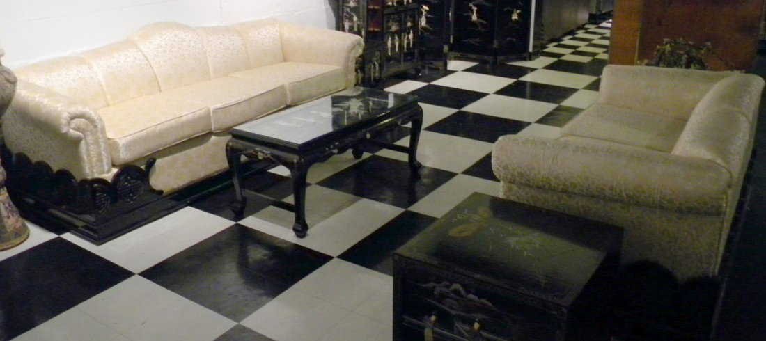 Matching Oriental Style Couch and Loveseat: Matching Oriental style couch and love seat: both with cream upholstery decorated with gold dragons and flowers, black lacquered bases with carved scrolls and Asian designs. Couch 88" long, loveseat 6