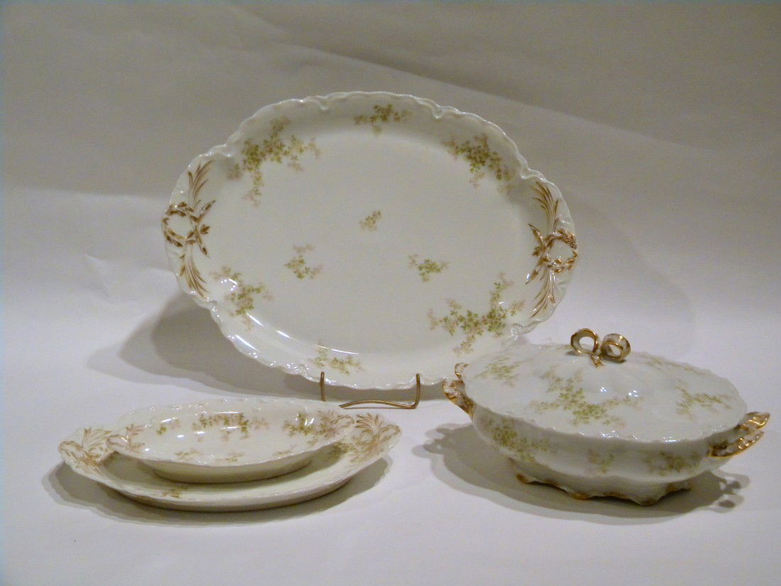 4 Pc Haviland Limoges Porcelain Dish Set: 4 Pc Haviland Limoges Porcelain Dish Set - Two-Handled Lidded Casserole Dish, Large Oval Serving Platter (chipped on edge), Medium Oval Serving Platter, Small Oval Relish Dish. All decorated with pink