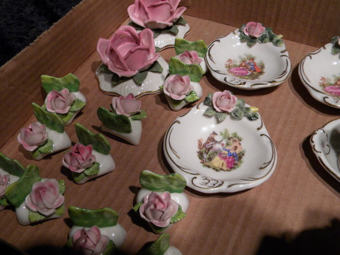 Dresden Germany (Crown) N mark porcelain table accessor: Dresden Germany (Crown) N mark porcelain table accessories decorated with painted and applied flowers and gilded accents: two small pitchers, pair candlesticks, twelve place card holders, mustard pot