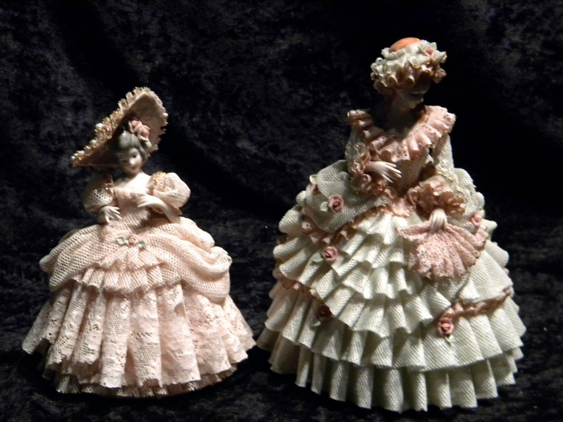 2 Dresden style glazed porcelain figural groups: woman: 2 Dresden style glazed porcelain figural groups: woman in pink dress and hat, marked in blue WB (Shield), Heirlooms of Tomorrow, made in USA. "Charlotte 105", (minor damage to lace), 7" high and woman