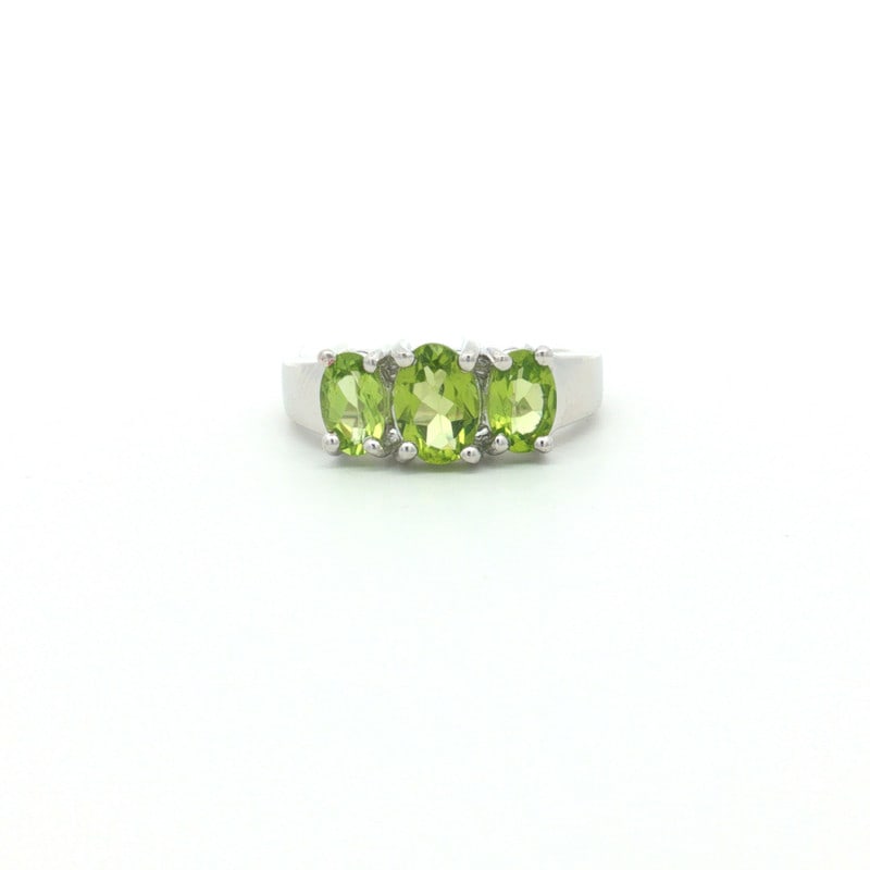 Peridot Oval 925 Sterling Silver Rhodium Ring: Elegant ring crafted in 925 sterling silver, featuring Peridot Oval, 7x5mm, 1 pcs; Peridot Oval, 6x4mm, 2 pcs. Finished with rhodium for a bright, polished appearance.Product Details:Main Gemstone: Pe