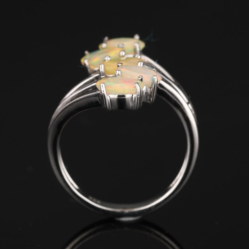 Ethiopian Opal Faceted Oval 925 Sterling Silver Rhodium Ring: Elegant ring crafted in 925 sterling silver, featuring Ethiopian Opal Faceted Oval, 6x4mm, 5 pcs. Finished with rhodium for a bright, polished appearance.Product Details:Main Gemstone: Ethiopian Opal 