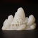 A CARVED WHITE JADE 'LANDSCAPE' BOULDER ,QING DYNASTY