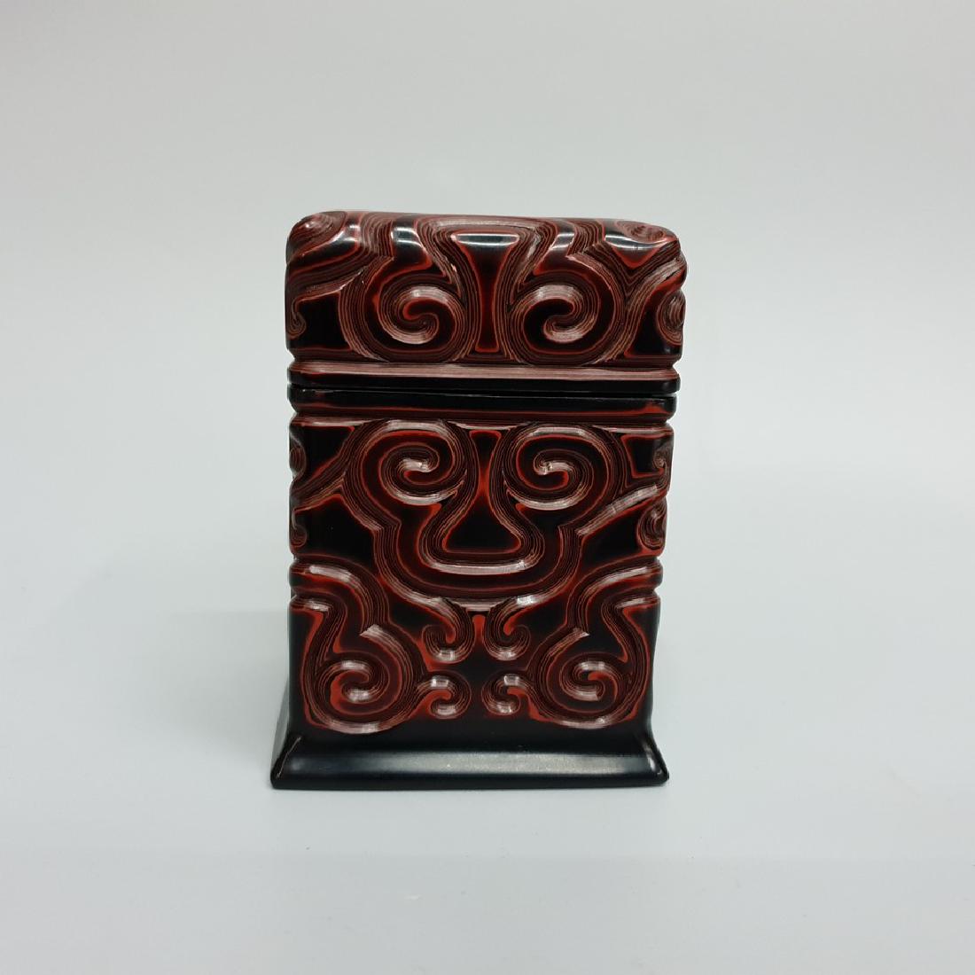 A CARVED BLACK-RED LACQUER BOX AND COVER ,QING DYNASTY (1 of 7)