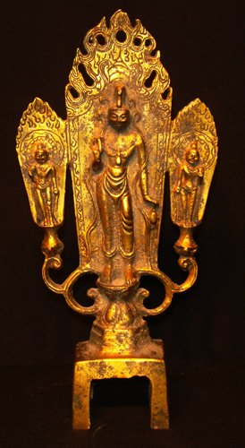 A RARE GILT-BRONZE BUDDHIST TRIAD TANG DYNASTY 9 1: Well cast as Buddha wearing robes that fall in crisp graceful folds seated between two bodhisattvas wearing simple ribbon-tied crowns and standing on petal socles, all three with hands in vitarka mudr