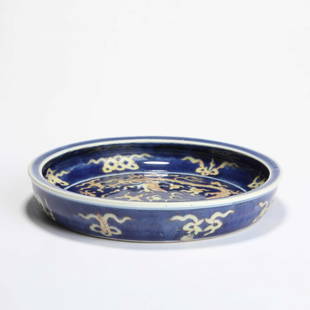 An Altar Blue Glaze Dragons Playing Charger: An Altar Blue Glaze Dragons Playing Charger 明隆庆霁蓝釉双龙戏珠折沿盘