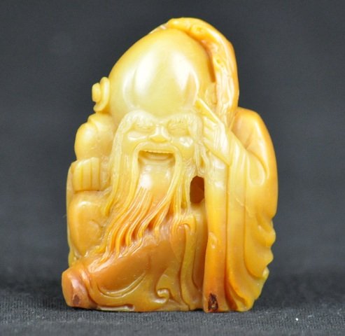 A YELLOW SOAPSTONE CARVING OF SHOULAO.: A YELLOW SOAPSTONE CARVING OF SHOULAO.3'' H