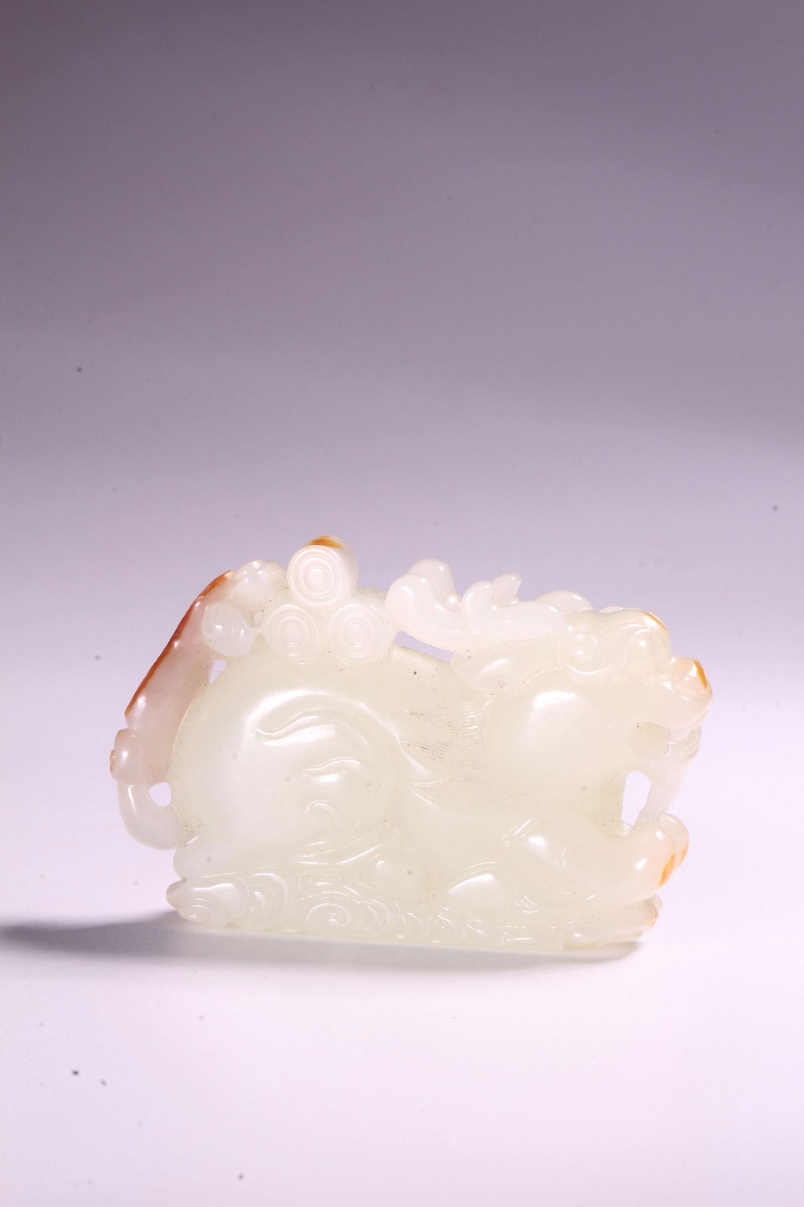 A CARVED WHITE JADE BEAST.QING PERIOD (1 of 9)