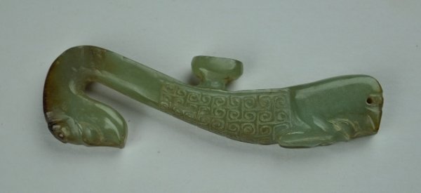 A GREEN JADE BELT HOOK. ( HAN DYNASTY): A GREEN belt hook ( HAN DYNASTY)3 1/2'' L