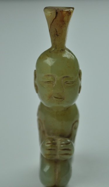 A YELLOW JADE CARVING OF A BOY.( HAN DYNASTY): A yellow jade carving of boy ( HAN DYNASTY) 2 3/4'' L