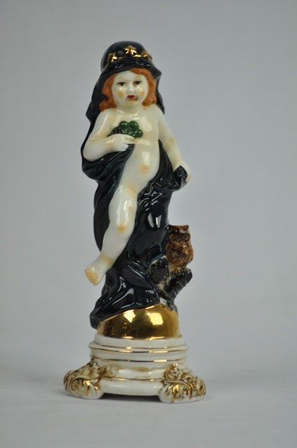 A MESSEN PORCELAIN PORCELAIN ALLEGORICAL FIGURE OF: A meissen porcelian allegorical figure of night .crossed swords mark in blue under glaze incised''J5'' and ''10'' 8''H Circa 1900