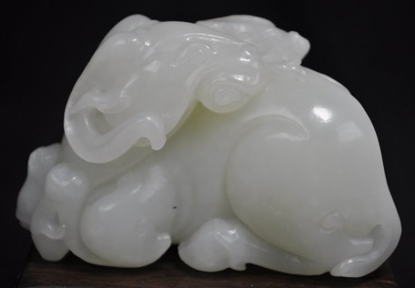 A WHITE JADE CARVING OF RAM.(QING 19 CENTURY): A White Jade Carving Of A Ram And A Ling Zhi In The Ram's Mouth.(Qing 19 CENTURY) 3 1/4'' x 2'' in