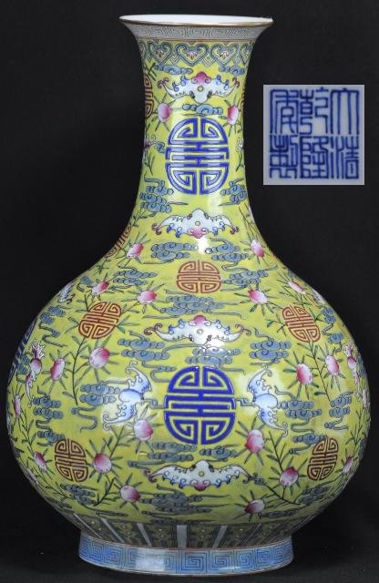 A FAMILLE-ROSE FU SHOU BOTTLE VASE.(MARK AND PERIOD: A famille-rose bottle vase decorated with shou characters with bats and peaches.(Mark And Period Of Qing Long) 16'' in Tall