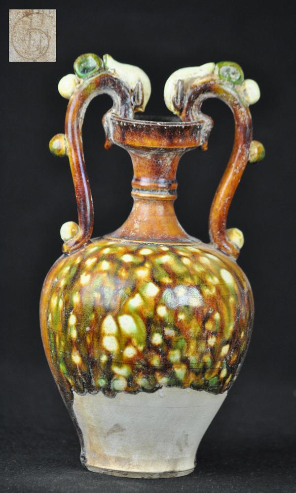 A SANCAI -GLAZED POTTERY PHOENIX HANDLED AMPHORA.: A sancai-glazed pottery phoenix handled amphra.(TANG DYNASTY) 10''H
