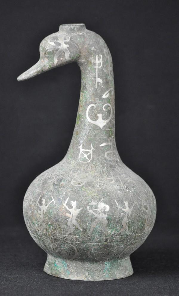A Rare silver inlaid Bronze Goose-Neck Vessel .( H: A Rare silver inlaid Bronze Goose-Neck Vessel .( HAN DYNASTY) 11 1/2''H