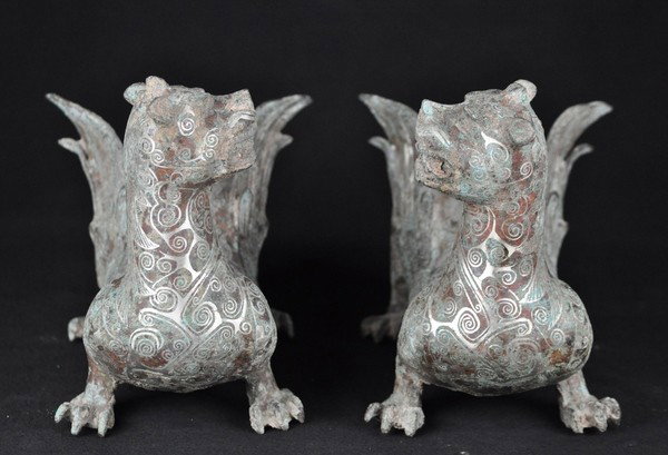 A PAIR OF SILVER INLAID BRONZE MYTHICAL BEAST.(HAN : A pair of silver inlaid mythical beast.(Han Dynasty) 8 1/2'' x 15''