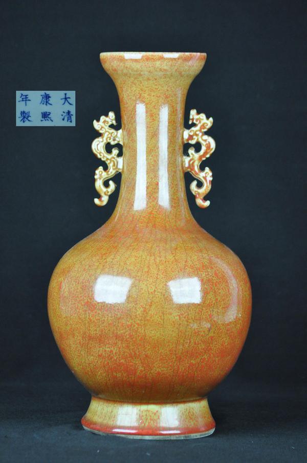 A SANG-DE-BOEUF BOTTLE VASE. (MARK OF KANGXI): A sang-de-boeuf bottle vase.(Mark Of Kangxi) 15''H