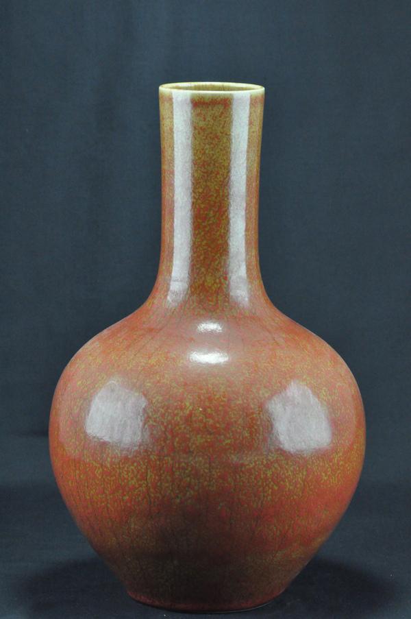 A SANG-DE-BOEUF BOTTLE VASE.(18th Century): A sang-de-boeuf bottle vase. 14-3/4''