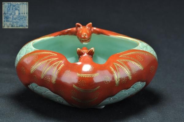 A FAMILLE-ROSE WATERPOT. (QIANLONG): A famille-rose waterpot decorated with bats six character marks on the base. 1-3/4'' x 8-3/4'' diam. (Mark and period of Qianlong.)