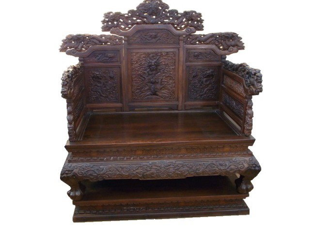 A WOOD THRONE CHAIR. ( QING DYNASTY): The chair carved on the with writhing five-clawed dragons amidst clouds.51''x33''x59''
