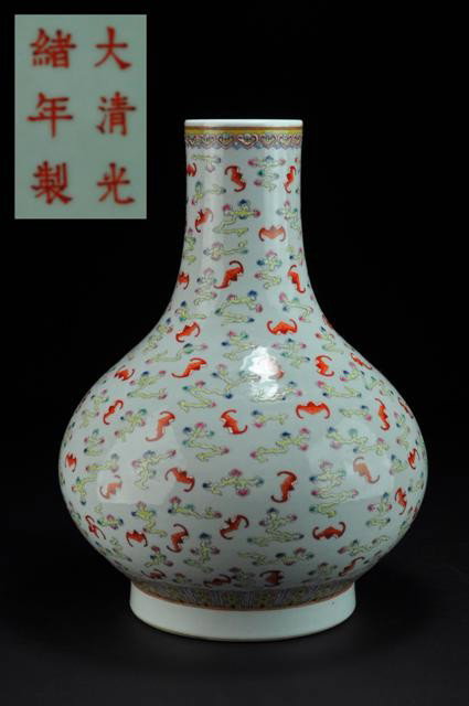 A FAMILLE ROSE PEAR-SHAPED VASE. ( MARK AND PERIO: Finely painted with a dense allover pattern of iron-red bats in flight amidst trailing multicolored clouds, all between borders of stylized lappets around the base and ruyi heads around the mouth.14 1