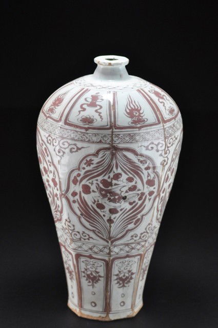 AN EXTREMELY RARE UNDERGLAZE-RED MEIPING .(YUAN D: the robustly potted broad-shouldered tapering body rising from a recessed base to a narrow short flaring neck with rolled rim, painted around the exterior in copper-red fired to silvery-red tones with