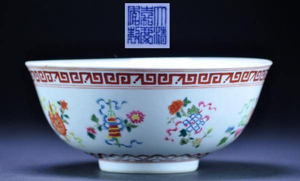 A 'FAMILLE-ROSE' 'BAJIXIANG' BOWL. (SEAL MARK AN: A 'FAMILLE-ROSE' 'BAJIXIANG' BOWL. (SEAL MARK AND PERIOD OF JIAQING) delicately potted with sides of the exterior finely painted with the bajixiang ('Eight Buddhist Emblems') divided into four pairs, 