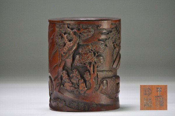 A CARVED BAMBOO BRUSHPOT .(18TH/19TH CENTURY ): - A CARVED BAMBOO BRUSHPOT .(18TH/19TH CENTURY ) Well carved with t scholars seating beside a pine tree in a mountainous landscape and boat, four character mark.16.5 x13 cm.