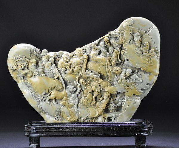 A LARGE SOAPSTONE CARVING MOUNTAIN.: - A LARGE SOAPSTONE CARVING MOUNTAIN. the stone finely carved 18 luohan in garden scenes.25x34cm.