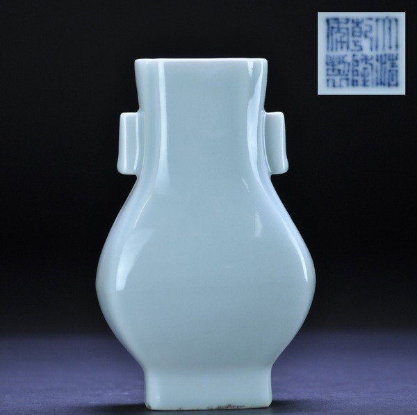 AN ARCHAISTIC FACETED PEAR-SHAPED VASE FANG HU (QI: - AN ARCHAISTIC FACETED PEAR-SHAPED VASE FANG HU (QIANLONG SEAL MARK IN UNDERGLAZE BLUE ) Of square section and raised on a slightly flared pedestal foot, the neck flanked by a pair of faceted lug han