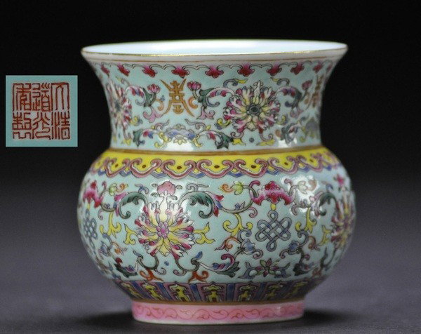 A FAMILLE-ROSE BOWL .(MARK AND PERIOD OF JIAQING): - A FAMILLE-ROSE BOWL .(MARK AND PERIOD OF JIAQING) of beechive form brightly enamelld around the interior with leafy lotus,batsand shou below a ruyi collar at the broad mouth,JiaQing mark on base.9x8